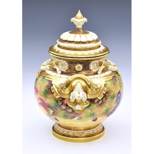 101 - A Royal Worcester large two handled urn and cover, hand-painted with fruit, by D Shinnie, with an or... 