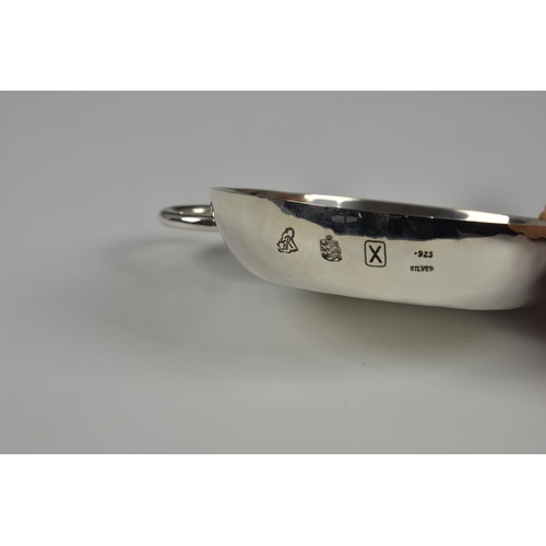 1014 - A Channel Islands silver tastevin, Bruce Russell, Guernsey, 1997, of typical form with loop handle, ... 