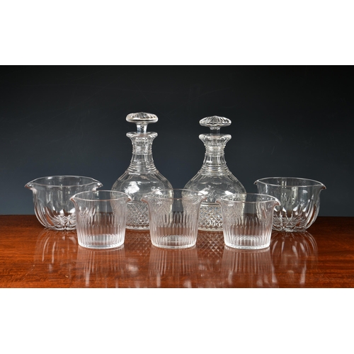 147 - A pair of late Georgian cut glass mallet decanters, having hobnail, slice cut and ribbon decoration,... 