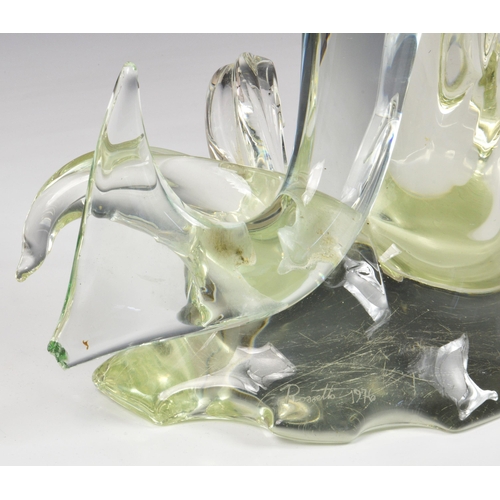 174 - A large Murano glass fish sculpture, signed Rostrato 1976, clear and green glass fish, jumping over ... 