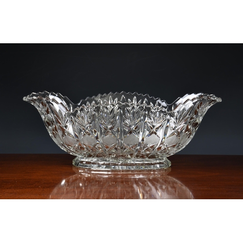 179 - A pair of large heavy moulded glass boat shaped vases / table centrepiece bowls, having pineapple cu... 