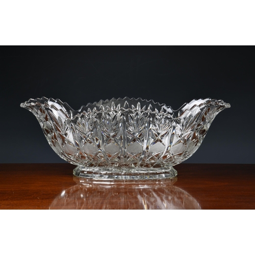 179 - A pair of large heavy moulded glass boat shaped vases / table centrepiece bowls, having pineapple cu... 