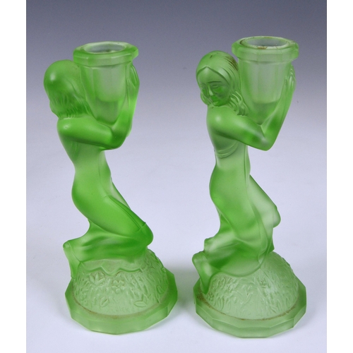 184 - A pair of Art Deco 'Three Graces' moulded uranium glass tazzas, the central column moulded as three ... 