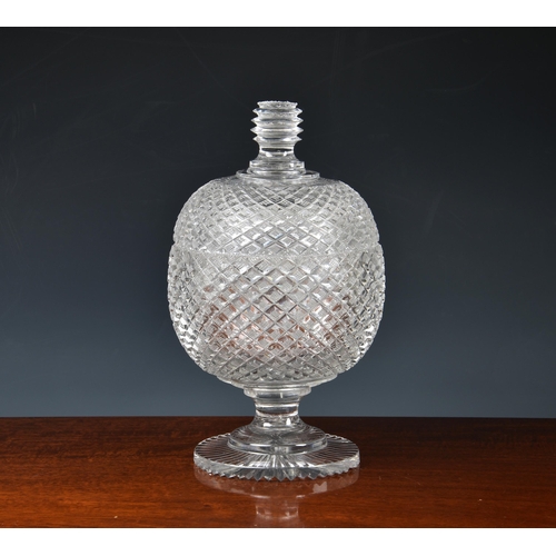 197 - A Georgian cut glass covered pedestal bowl, the globular bowl and cover with strawberry diamond cut ... 