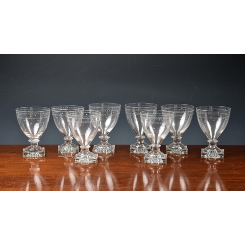 200 - A set of eight Georgian etched glass square base rummers, with star and band etched ovoid bowls on a... 