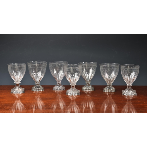 200 - A set of eight Georgian etched glass square base rummers, with star and band etched ovoid bowls on a... 