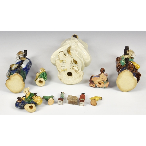2256 - A collection of Chinese stoneware and porcelain figures, 20th century, comprising a large stoneware ... 