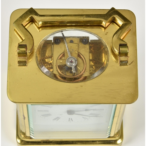 241 - A late 19th century French brass carriage clock with leather travel case, the white enamel dial with... 