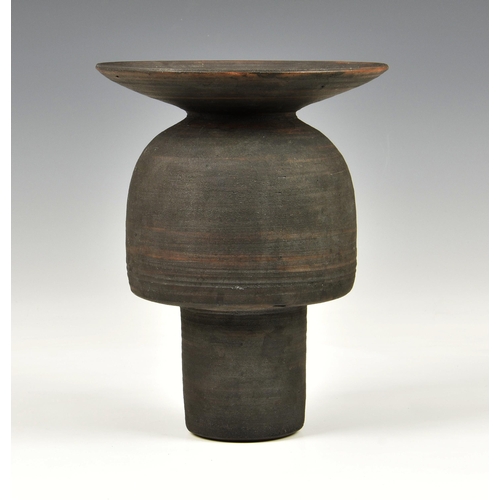 27 - A stoneware studio pottery vase in the manner of Hans Coper, 1970s, with disc rim over an inverted c... 