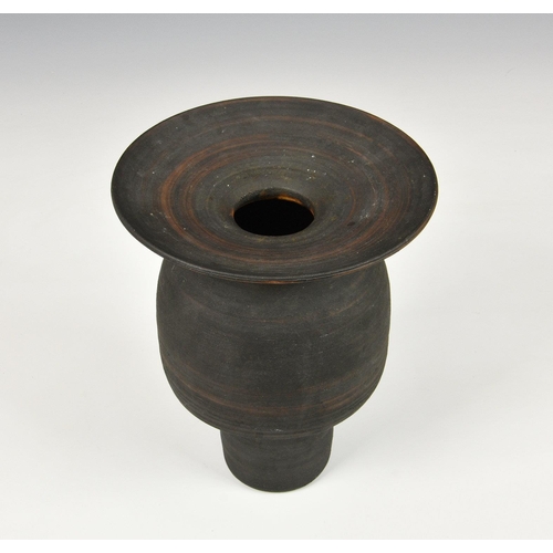 27 - A stoneware studio pottery vase in the manner of Hans Coper, 1970s, with disc rim over an inverted c... 