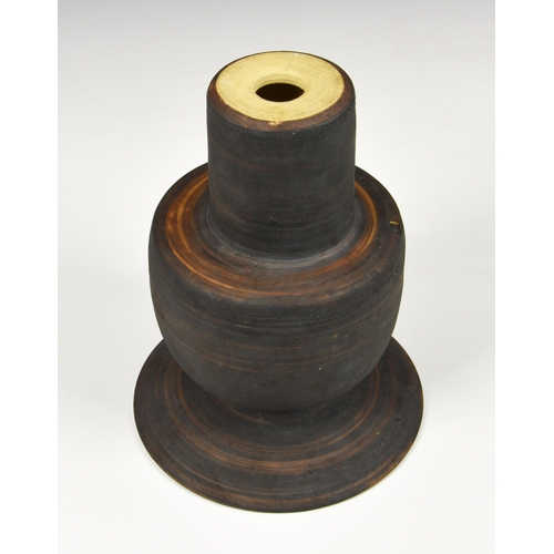 27 - A stoneware studio pottery vase in the manner of Hans Coper, 1970s, with disc rim over an inverted c... 