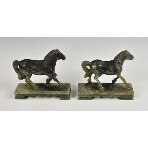 2865 - A near pair of carved green soapstone horses, 20th century, raised on rectangular plinths, 6 ½in. (1... 