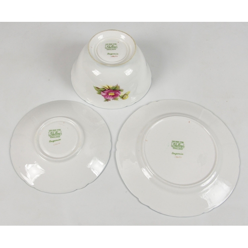 45 - A partial set of eleven Shelley Begonia pattern trios, each trio comprising a tea cup, saucer and pl... 