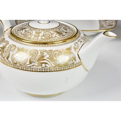 61 - A Wedgwood China 'Gold Florentine' pattern tea service, comprising of teapot, six cups & saucers, ca... 