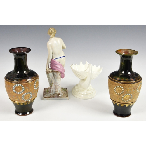 64 - A small collection of antique ceramics, to include a Continental earthernware semi-nude female figur... 