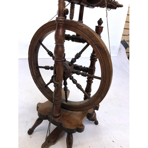 754 - A late 19th / early 20th century beech wood, pine and yew spinning wheel, overall height 37in. (94cm... 