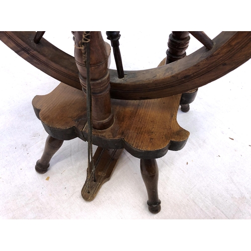 754 - A late 19th / early 20th century beech wood, pine and yew spinning wheel, overall height 37in. (94cm... 