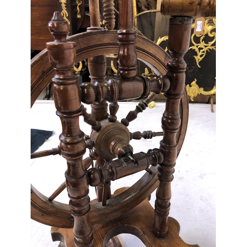 754 - A late 19th / early 20th century beech wood, pine and yew spinning wheel, overall height 37in. (94cm... 