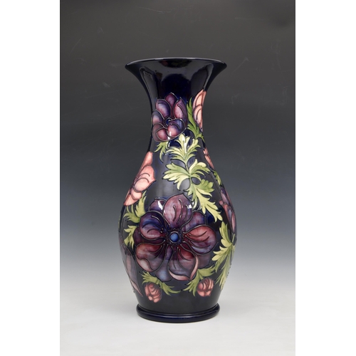 10 - A large Moorcroft Pottery floor standing baluster vase, with flared rim, 'anemone' pattern, on blue/... 