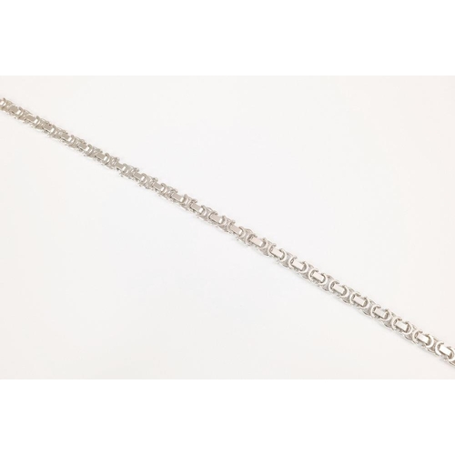 1005 - A 9ct white gold fancy link bracelet, approx. 18.2cm long, with lobster clasp.