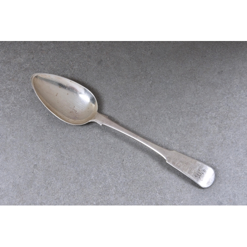 102 - A Channel Islands silver fiddle pattern table spoon, maker's mark GH with crown above, struck once (... 