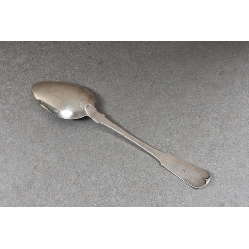 102 - A Channel Islands silver fiddle pattern table spoon, maker's mark GH with crown above, struck once (... 