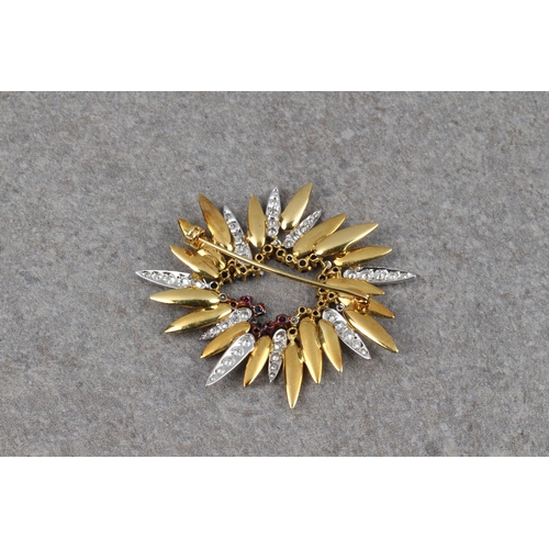 1074 - A vintage modernist 18ct two colour gold, sapphire and diamond sunburst brooch, the textured yellow ... 