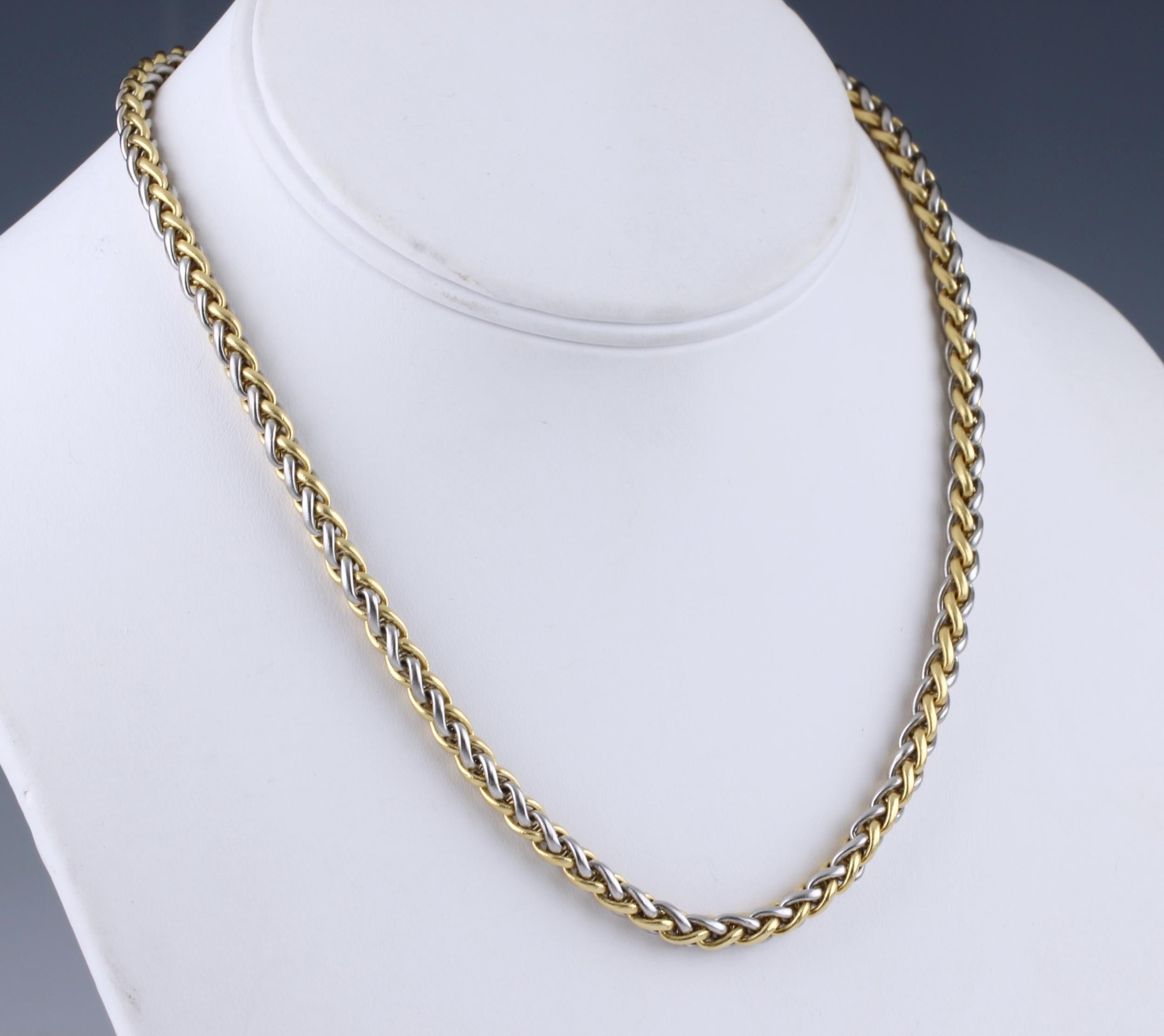 An 18ct two colour gold and diamond palma chain necklace, the clasp ...