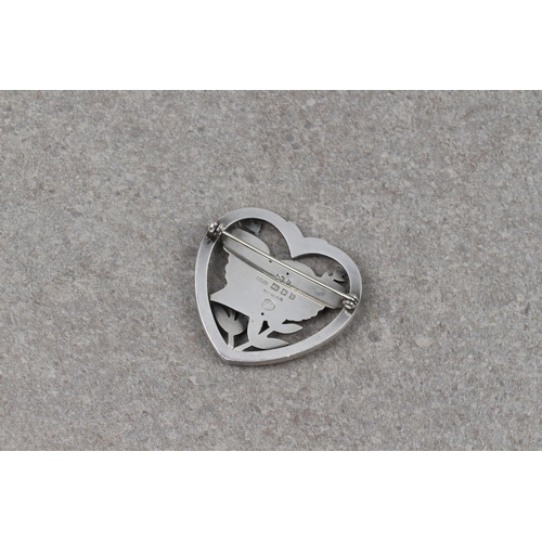 1083 - A Georg Jensen silver bird within a heart brooch, designed by Arno Malinowski, hallmarked London 195... 