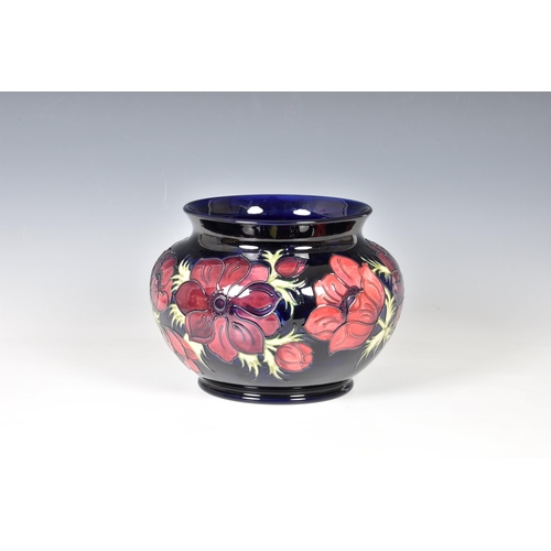 12 - A Moorcroft Pottery jardinière, by Walter Moorcroft, of squat ovoid form with short flared rim decor... 