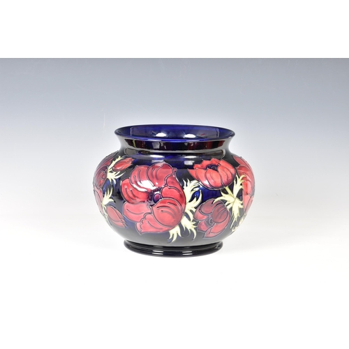 12 - A Moorcroft Pottery jardinière, by Walter Moorcroft, of squat ovoid form with short flared rim decor... 