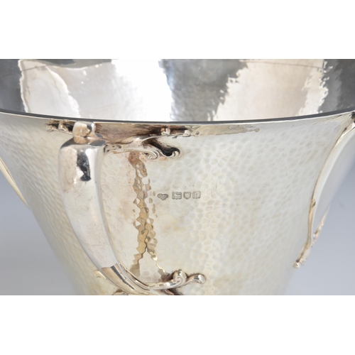 125 - A rare Art Nouveau planished silver centrepiece / twin handle trophy bowl, Goldsmiths & Silversmiths... 