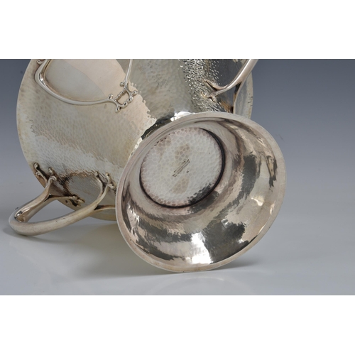 125 - A rare Art Nouveau planished silver centrepiece / twin handle trophy bowl, Goldsmiths & Silversmiths... 