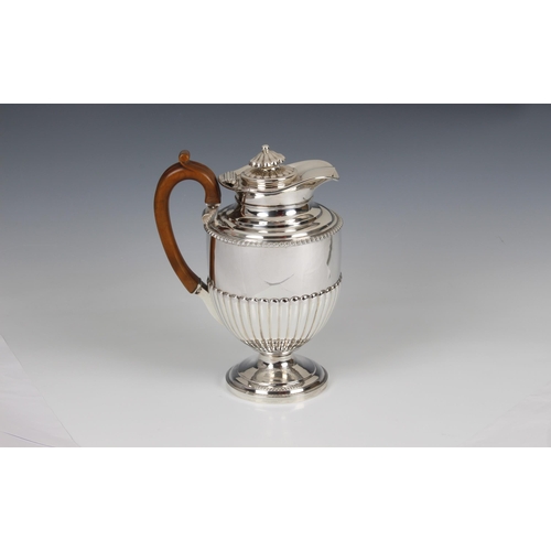 141 - A George III hallmarked silver pedestal coffee pot and cover, William Burwash, London, 1815, of circ... 