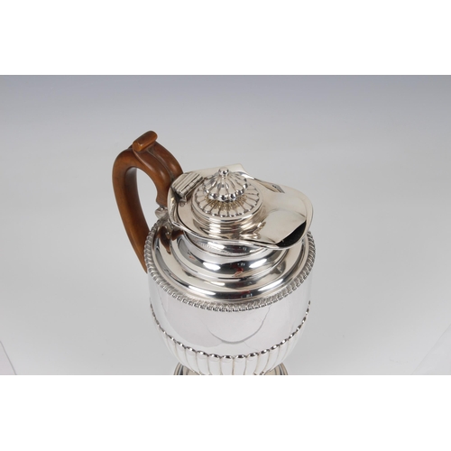 141 - A George III hallmarked silver pedestal coffee pot and cover, William Burwash, London, 1815, of circ... 