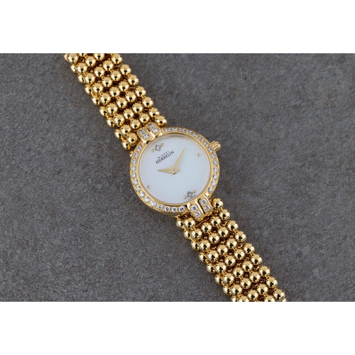 1430 - A ladies Michel Herbelin gold plated dress watch, ref. 7065.B, c.2001, the mother-of-pearl dial with... 