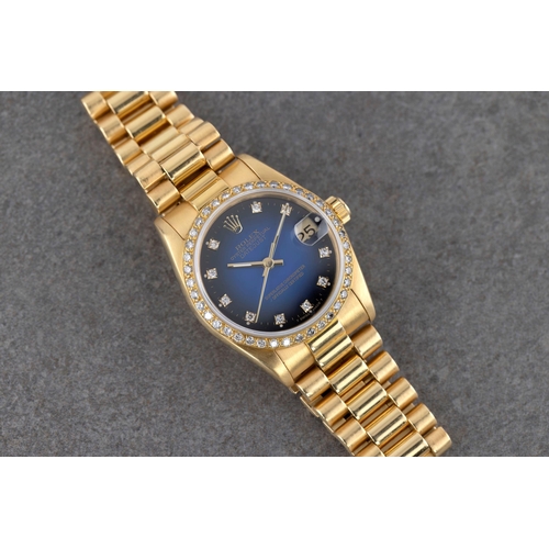 1433 - A 18ct gold and diamond diamond set mid-size Rolex Oyster Perpetual Datejust ladies bracelet wrist w... 