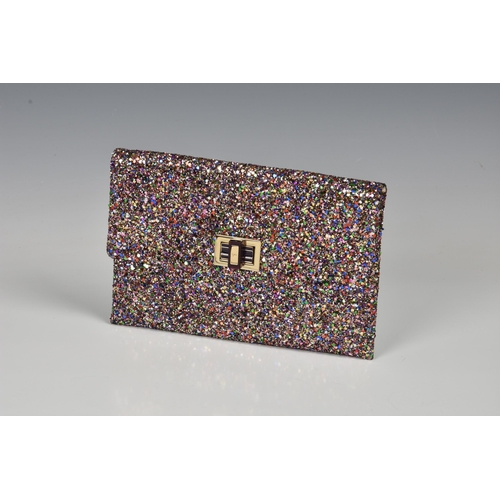 1447 - An Anya Hindmarch pink glitter clutch bag, with gold toned twist clasp and gold flap lining, the nud... 