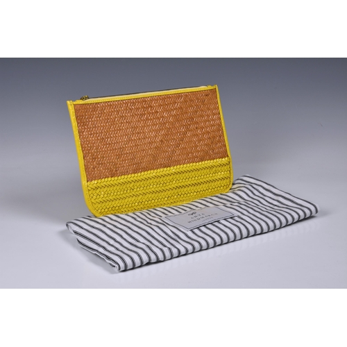 1448 - An Anya Hindmarch raffia clutch bag, in raffia and yellow woven leather, with monogram lining and si... 