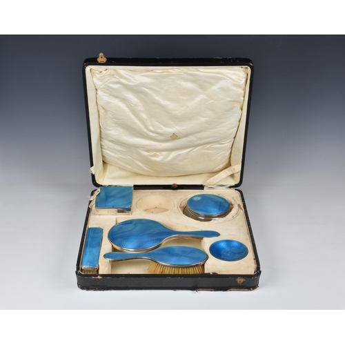 147 - A cased George V silver and guilloche enamel dressing table set, Henry Clifford Davis, Birm. 1924, c... 