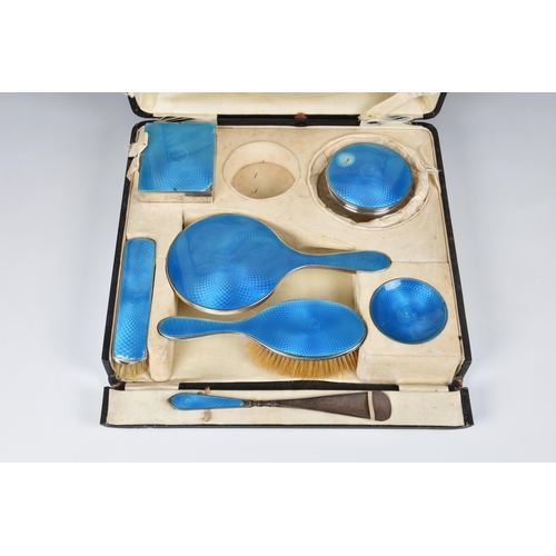 147 - A cased George V silver and guilloche enamel dressing table set, Henry Clifford Davis, Birm. 1924, c... 