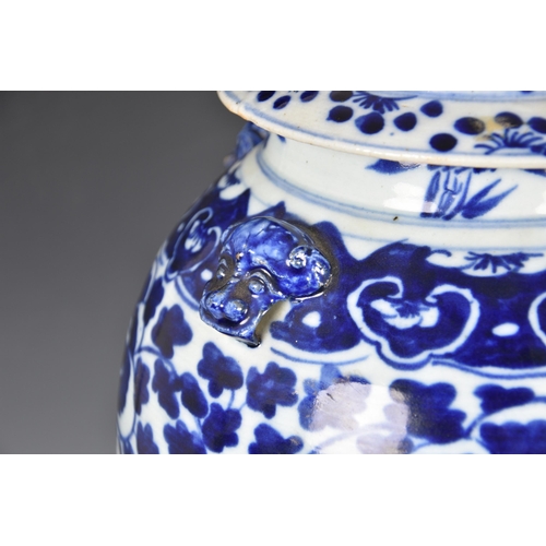 1472 - A Chinese blue and white porcelain covered vase, 20th century, ovoid with flared foot and short, sli... 