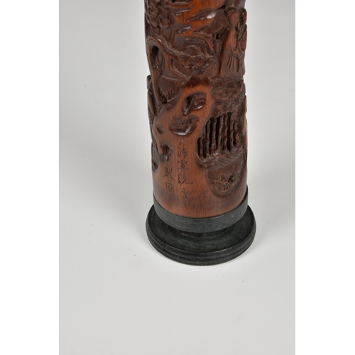 1473 - A Chinese carved bamboo parfumier, 20th century, carved with scholars in a rocky, wooded landscape w... 