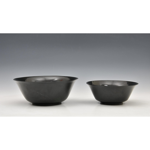 1476 - A graduated pair of Chinese deep spinach green jade bowls, probably 20th century, of deep, rounded f... 