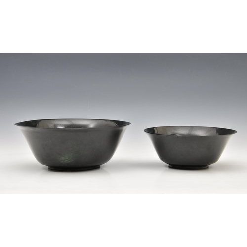 1476 - A graduated pair of Chinese deep spinach green jade bowls, probably 20th century, of deep, rounded f... 