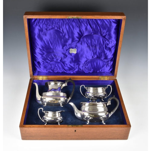 148 - An oak cased George V silver four piece tea and coffee service, Joseph Rodgers & Sons, Sheffield 191... 