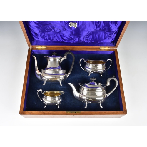 148 - An oak cased George V silver four piece tea and coffee service, Joseph Rodgers & Sons, Sheffield 191... 