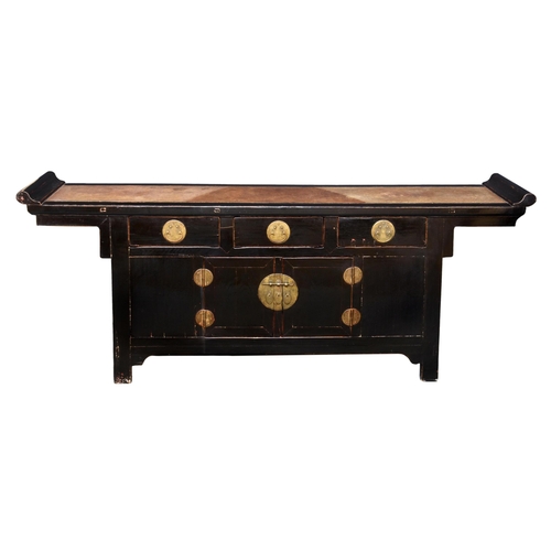 1483 - A Chinese black lacquered elm wood low chest, probably Qing Dynasty, mid-19th century, the rattan pa... 