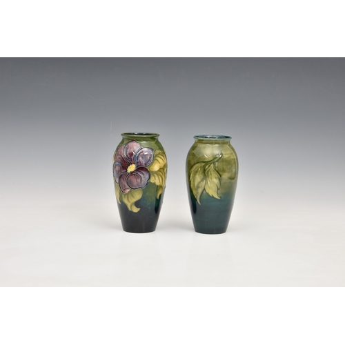 15 - A Moorcroft Pottery ovoid vase, 'clematis' pattern on fading blue / green ground, c.1950-1986, vario... 