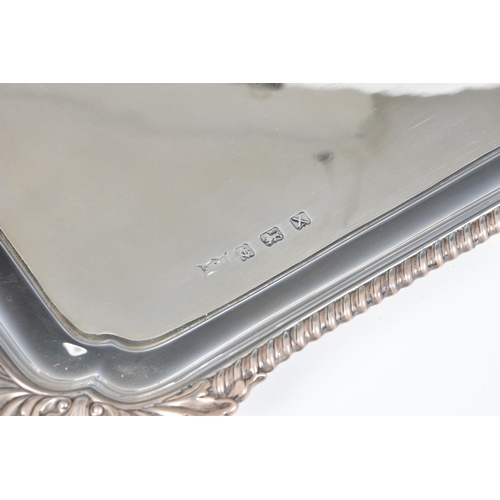 150 - A George VI silver drinks or tea tray, B. Bros., Birm. 1947, of rectangular form with two, angular, ... 